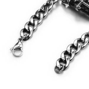 Retro stainless steel Cuban link bracelet with vintage cross detail and lobster clasp