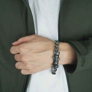Retro titanium steel Cuban chain bracelet with black leather and cross detail on wrist