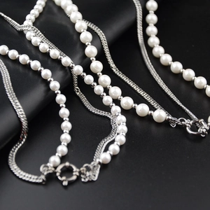 Hiphop style multilayer necklace with white pearls and silver metal flat chains on leather