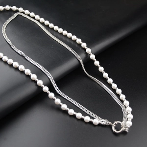 Hip-hop style layered pearl and silver curb chain necklace with a spring clasp buckle