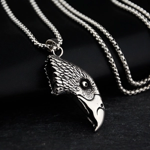 Macro shot of eagle head pendant with realistic feather texture and durable steel chain