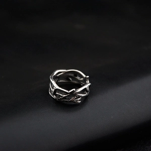 Gothic thorn vine ring in vintage oxidized steel finish on black leather texture