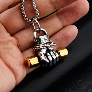 Hip hop fitness necklace with fist holding a gold dumbbell pendant in titanium steel