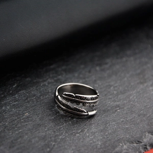 Vintage hip hop feather ring in oxidized titanium steel with adjustable open band design