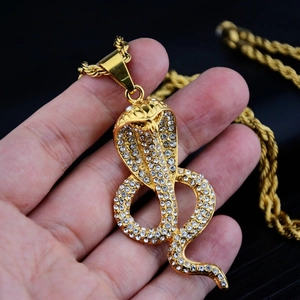 Iced out cobra snake pendant necklace in gold finish with a thick rope chain for hip hop style