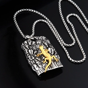 Hip hop titanium steel lizard necklace with a two-tone gecko pendant on black background