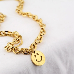 Double-layered gold smiley face necklace featuring a Love Life engraved pendant and thick chains