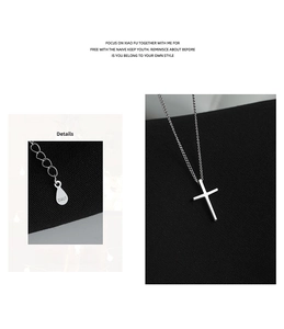 Detail shot of S925 sterling silver stamp on minimalist cross pendant necklace