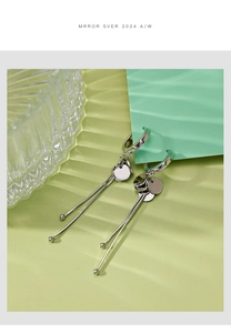 Detail of S925 sterling silver long tassel earrings with shimmering metal sequins