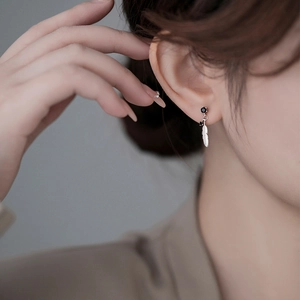 Elegant 925 sterling silver feather drop earrings with black gemstone for women