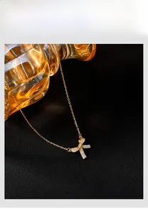 Detailed view of 925 silver bow pendant necklace with sparkling pavé zircons