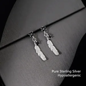 Elegant 925 sterling silver feather earrings with black zircon on a dark textured base