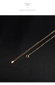 Detail of S925 sterling silver lobster clasp and adjustable chain on gold necklace