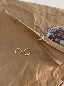Three-piece gold ear cuff set featuring pavé crystals, twisted rope, and smooth designs