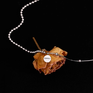 Minimalist 925 sterling silver lucky necklace featuring a double chain and engraved pendant