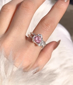 Close-up of S925 silver ring featuring pink heart gemstone and textured lava band