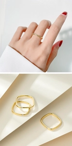 Detail of square 925 silver ring in gold finish with a small inlaid crystal stone