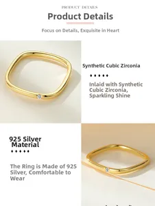 Macro details of square 925 sterling silver ring with gold finish and cubic zirconia