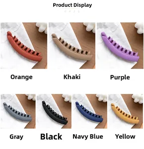Detailed palette of matte banana hair clips in seven versatile dark and earthy tones
