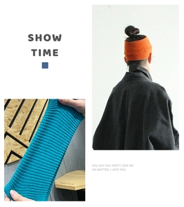 Detail of ribbed knit headbands in orange and teal showing elastic texture and soft fabric