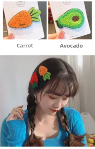 Detail of knitted fruit hair clips featuring strawberry, carrot, and avocado embroidery