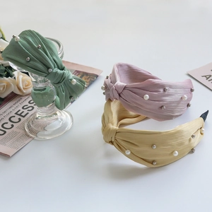 Elegant pleated fabric headbands with pearls in green, pink and beige for women