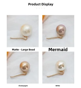 Detail view of pearl ponytail hair pins in matte, iridescent purple, and champagne colors