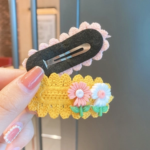 Handmade crochet flower hair clips for girls featuring cute daisy designs and BB clips