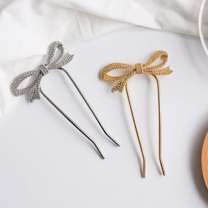 Minimalist U-shaped metal hairpins with shimmering bow knots in gold and silver finish