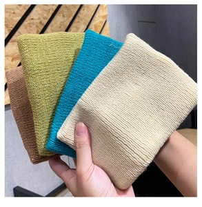 Close-up detail of knitted sports headband in multiple solid colors for women