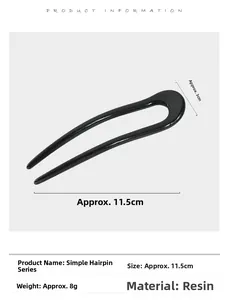 Detailed view of black resin U-shaped hair pin with 11.5cm length and polished finish
