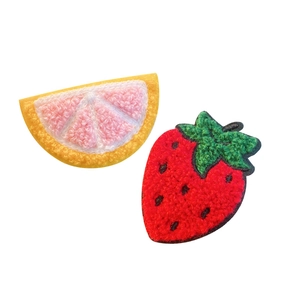 Cute fruit hair clips featuring knitted strawberry and citrus designs in soft toweling texture