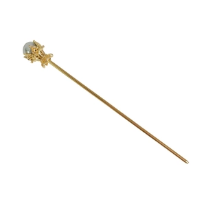 Épingle à cheveux en métal doré avec perle grise dans une monture fleur de lotus