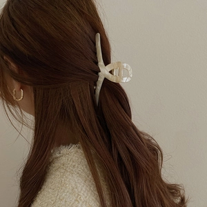 Minimalist pearl white acetate hair claw clip for thick hair styling in elegant cross design