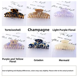Detailed set of medium acetate hair claws in six elegant patterns and colors for women