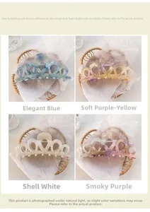 Detail view showing four crown-shaped marble textured hair claws in various elegant colors
