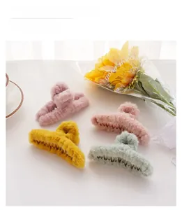 Detail view of plush colorful hair claws in soft faux fur for thick hair styling
