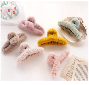 Detail showing various colors of plush hair claws with soft faux fur texture for winter