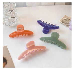 Set of four large matte acetate hair claws in assorted soft candy colors for thick hair