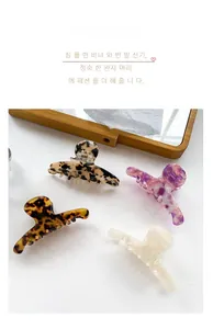Detailed set of acetate hair claws in leopard print, tortoiseshell, and marble patterns