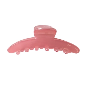 Pink acetate hair claw clip with a glossy candy color finish for simple hairstyling