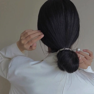 Minimalist silver metal hair pin with hammered ring and pearl for ponytail hairstyle