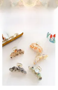 Detailed set of five large acetate and resin hair claws with premium marble patterns