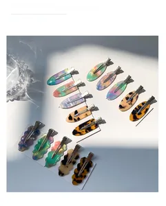 Detailed set of 14 marble pattern acetate hair clips in various shapes and colors