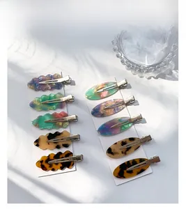 Assorted cellulose acetate hair clips set with marble and tortoiseshell patterns