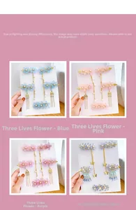Detail of floral hair clips with long metal tassels and faux pearl accents