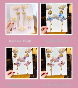 Detail view of Chinese style butterfly and floral hair clip set with long tassels and bells