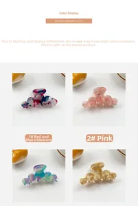 Close-up of marble pattern hair claws in red, blue, and pink artistic resin finishes
