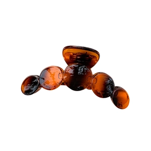 Glossy amber resin hair claw clip with minimalist circular design for women buns