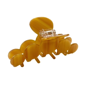 Amber acetate claw clip with translucent layered disk design and metal spring